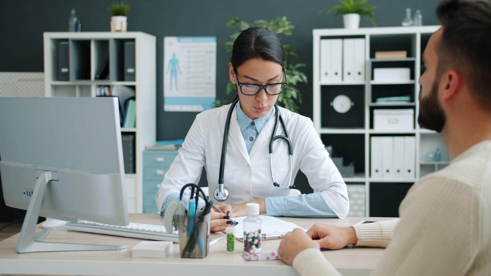 A consultation between a clinician and a patient during an assessment.